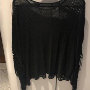 Fringed poncho knit top